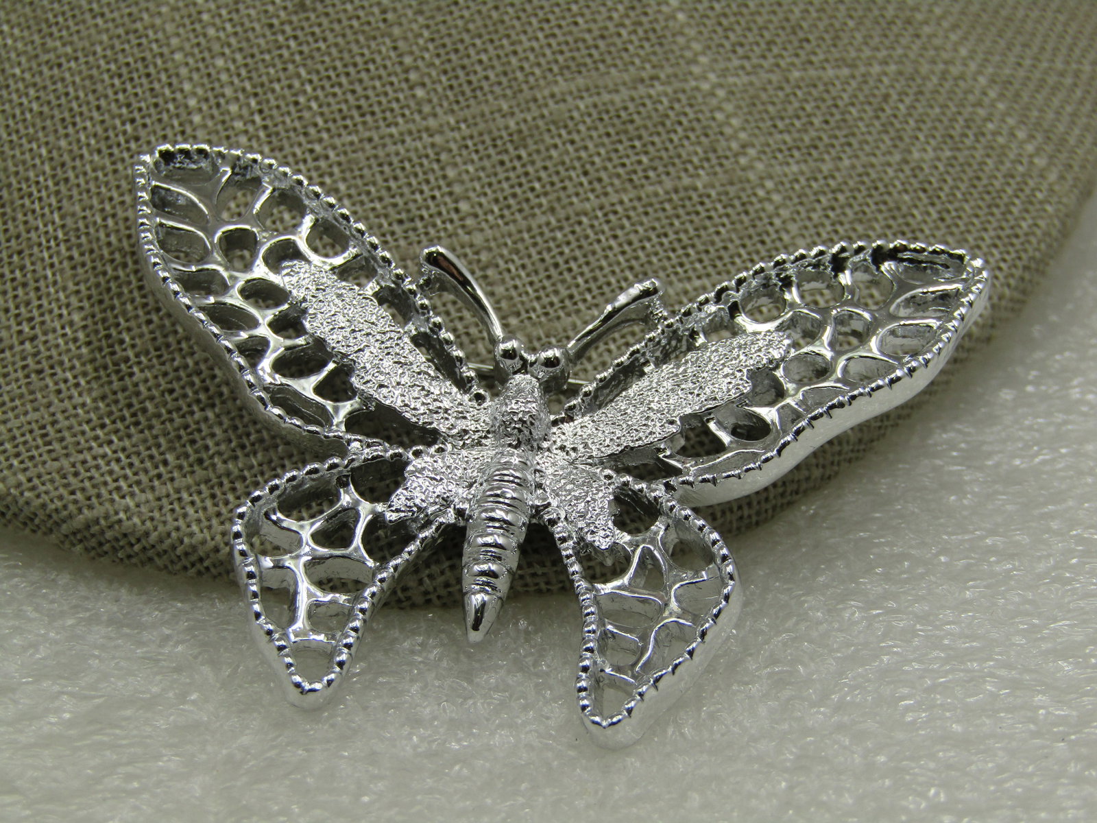 Vintage Silver Tone Butterfly Brooch, Sarah Coventry, 1960's-1970's: Vintage Silver Tone Butterfly Brooch, Sarah Coventry, 2.5" by 2". It comes in the original box. The butterfly is in very good condition, the box has some wear. Age is appx. 1960's-1970's. (INV. W.8212