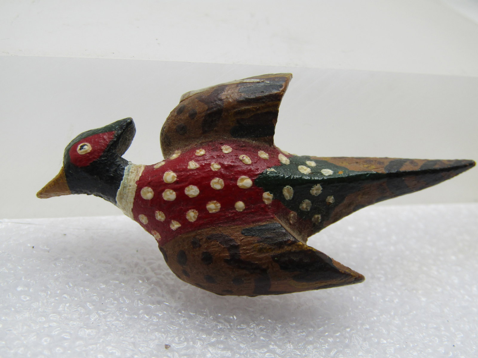 Vintage Carved Hand Painted Pheasant Brooch, 1960's-1970's: Vintage Carved Hand Painted Pheasant Brooch, 1960's-1970's. wooden brooch that is appx. 2-1/8" wide and 1.25" tall painted pheasant in flight. It is not signed or marked. Very good condition. (W21523.