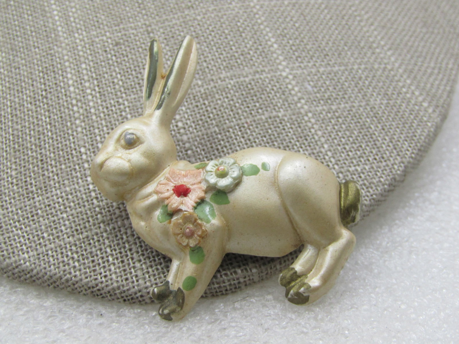 Vintage Plastic Painted Rabbit Brooch, 1930's-1940's: Vintage Plastic Painted Rabbit Brooch, 1930's-1940's. Off white shimimery rabbit with painted and raised floral accents. Plastic/celluloid - very cute and well taken care of, not scratched and worn