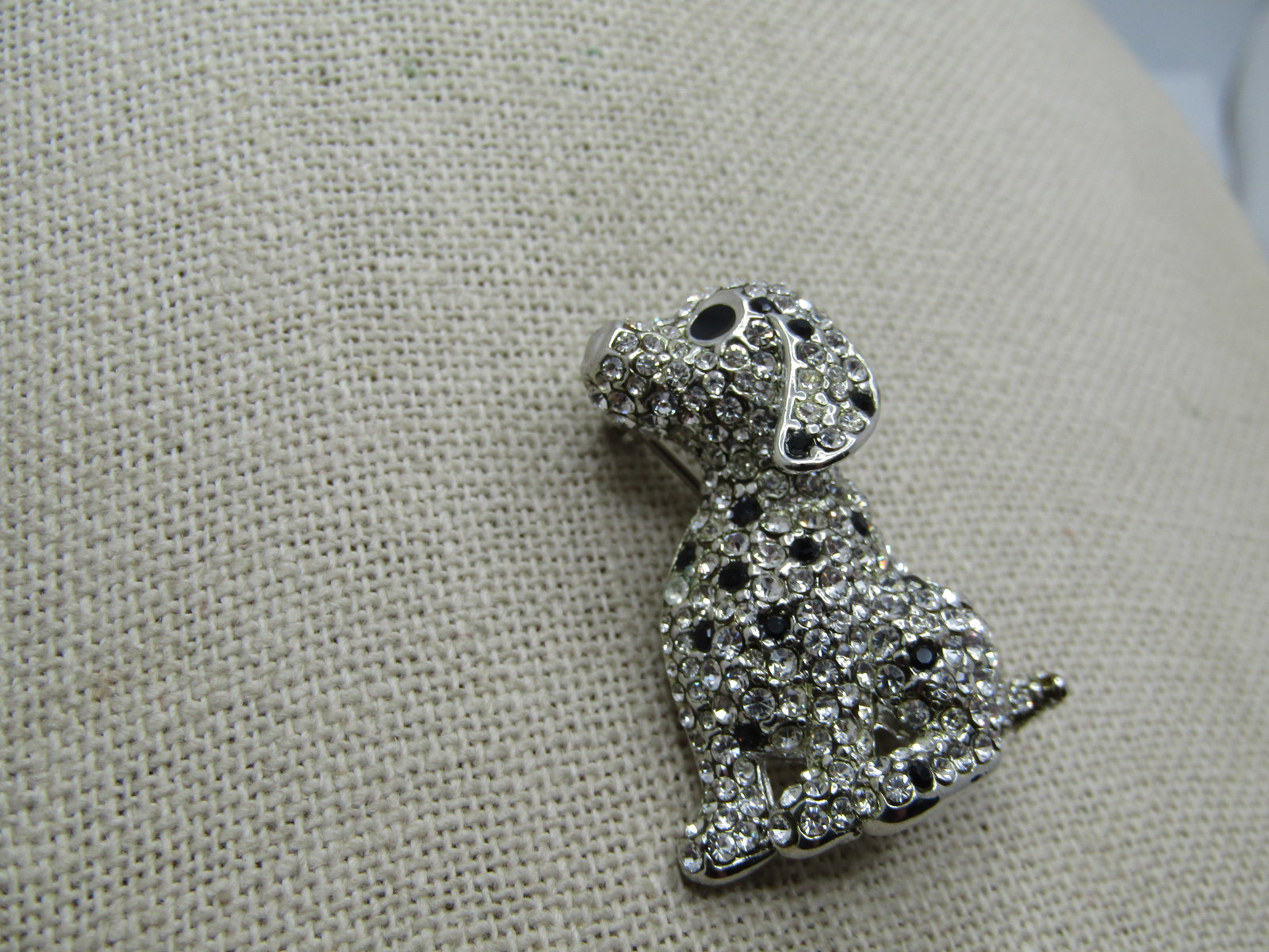Vintage Rhinestone Dalmation Dog Brooch, Black/Clear, 1980's: Vintage Rhinestone Dalmation Dog Brooch, Black/Clear, 1980's. Silver tone and 1.25" tall and 2" wide. Black rhienstone eyes and spots of black rhinestones among the clear pave-set rhinestones througho