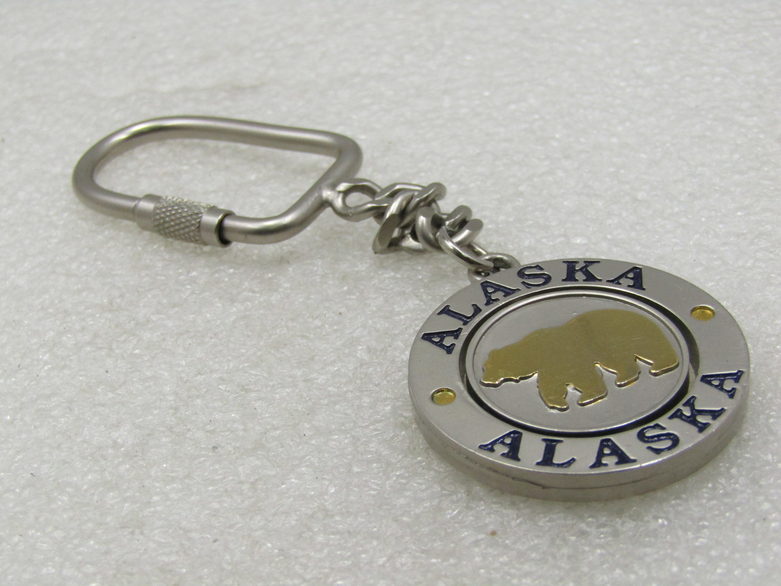 Vintage Alaska Key Chain, Two-Tone with Bear & Moose: Vintage Alaska Key Chain, Two-Tone with Bear & Moose. I thas a medallioin style fob that has Alaska on the top and bottom frame with a swiveling center with a gold tone moose on one side and bear on