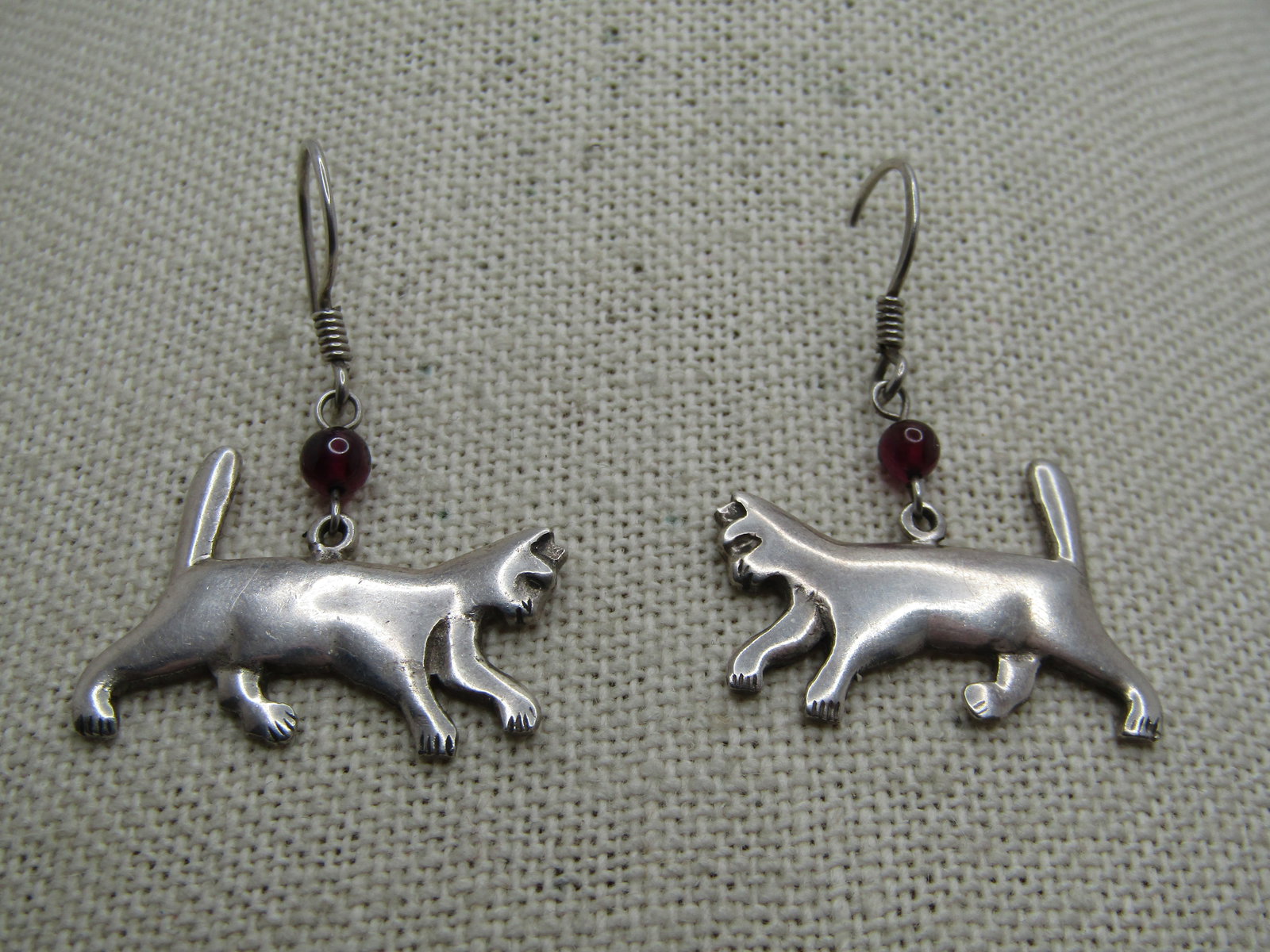 Vintage Sterling Silver Cat Earrings, Dangle-Pierced, 1980's-1990's: Vintage Sterling Silver Cat Earrings, Dangle-Pierced, 1980's-1990's. They have am amethyst 4mm bead between the cat and the hook post. APpx. 1" long from curve in post and 1-1/8" wide. Very good