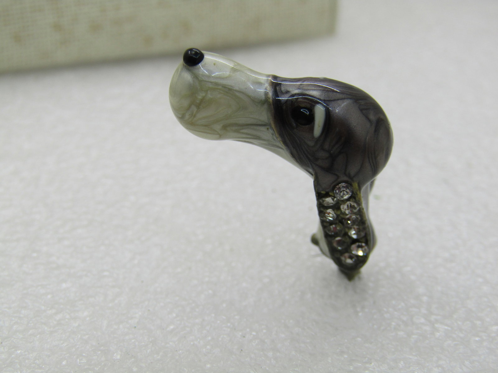 Vintage Enameled Dog Head on Spindle, Rhinestone Ears, Part to Bottle Stopper or something else: Vintage Enameled Dog Head on Spindle, Rhinestone Ears, Part to Bottle Stopper or something else. Gray and white pearly heavy enameling heavy metal spaniel or pointer head with pave rhinestone earls.