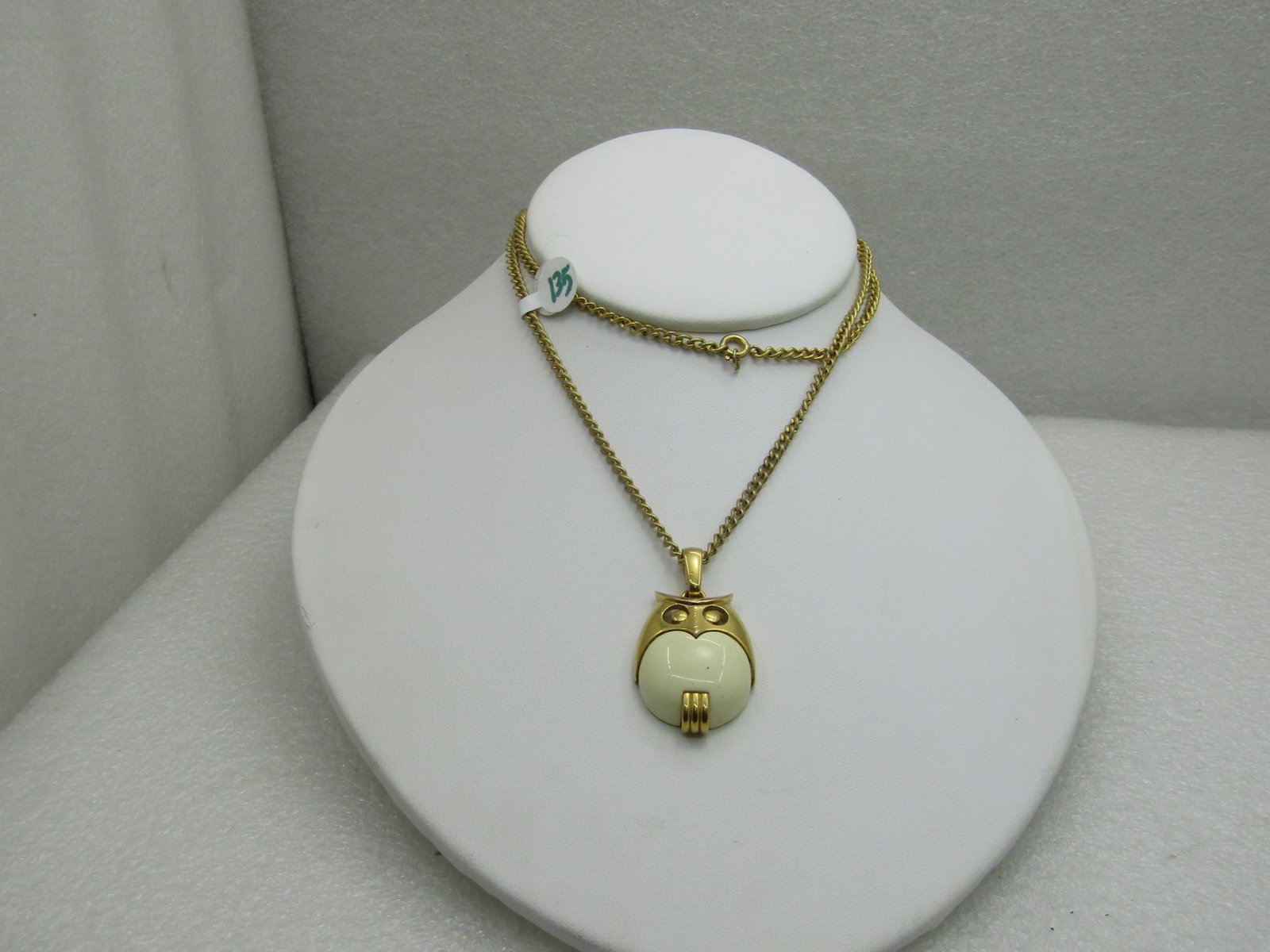 Vintage Gold Tone Owl Necklace 22": Vintage Gold Tone Owl Necklace, 22" with a 1.5" long and 1" wide rounded owl with a cream colored plastic torso and gold tone top. Cute rounded little owl with a smooth finish. The chain is a curb