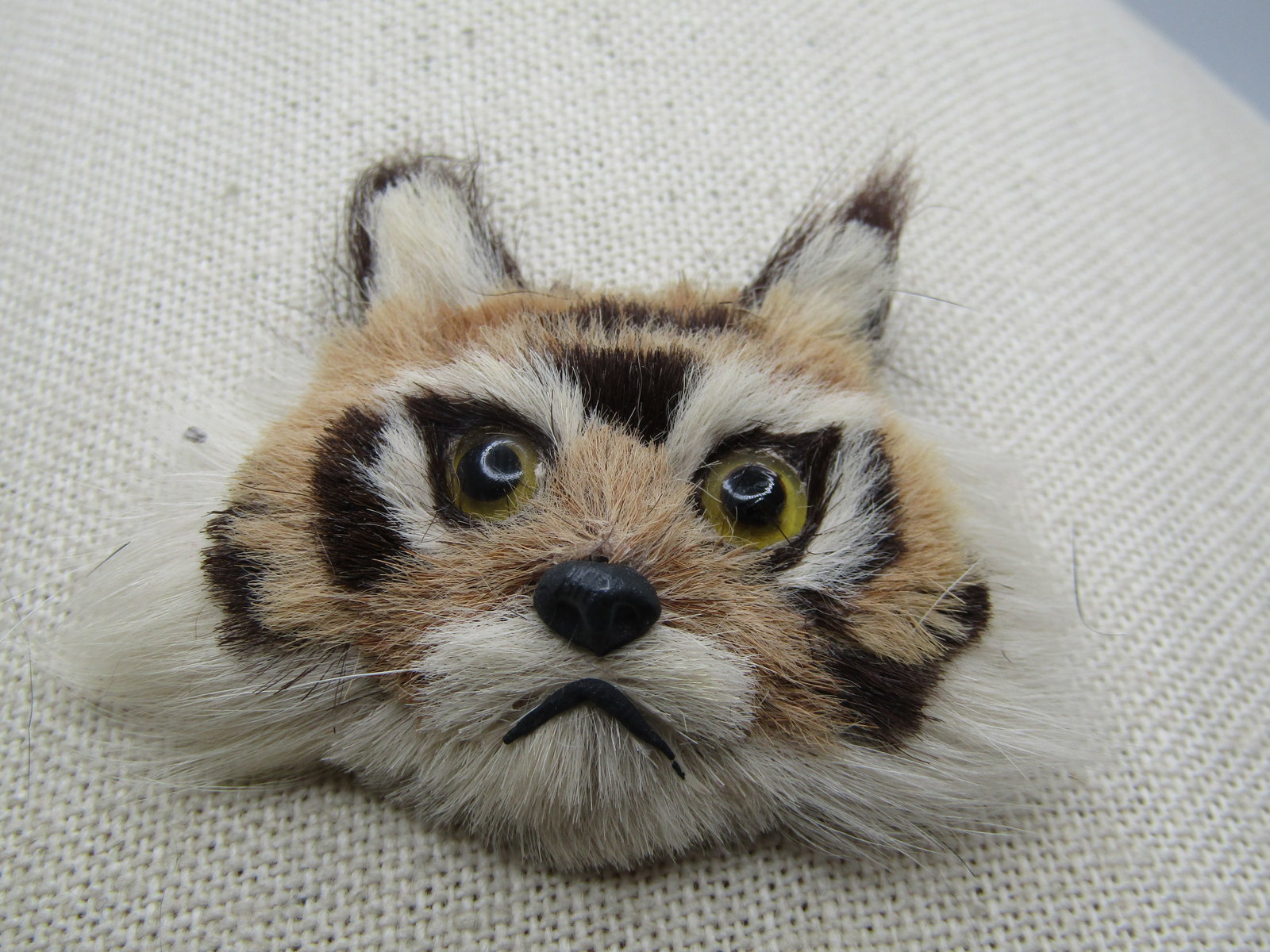 Vintage Tiger Face Fur Brooch, Handmade, 1950's-1960's. 2.5": Vintage Tiger Face Fur Brooch, Handmade, 1950's-1960's. 2.5" by 2". It has striped fur and a cute nose and mouth with glass eyes. Pointed ears and a felt back with a safety pin as the pin back. I'm no