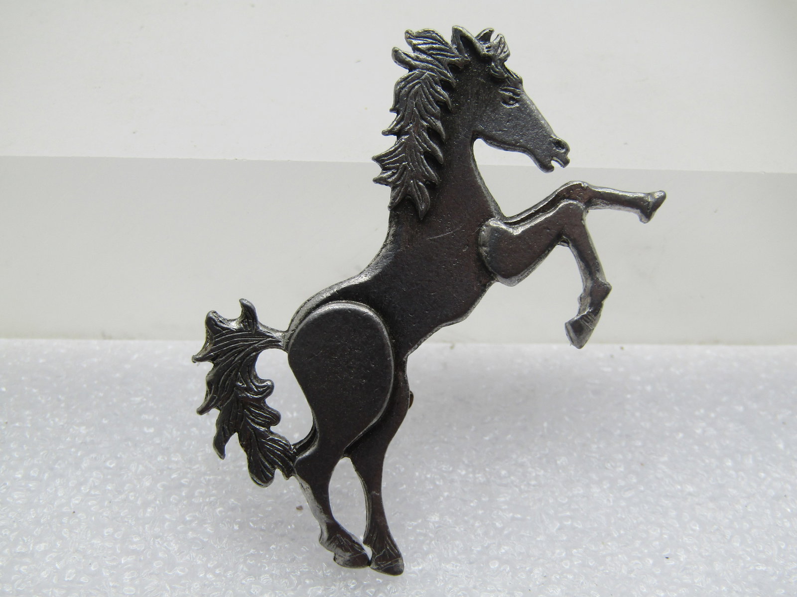 Vintage Pewter Horse Brooch, Signed Metzke, 1960-s-1970's: Vintage Pewter Horse Brooch, Signed Metzke, 1960s-1970's. It is in a running position and is appx. 1.75" wide and 1.25" tall. Signed Metzke on the back. Lockign clasp. Very good condition.