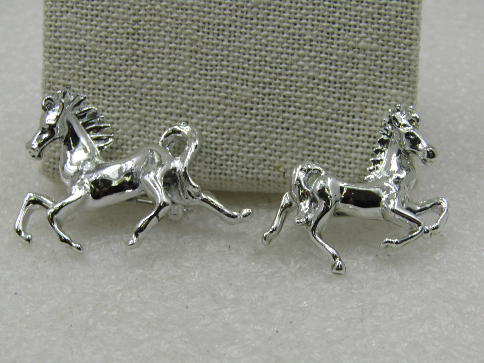 Vintage Two Horse Scatter Pin Set, Silver Tone, 1960's: Vintage Two Horse Scatter Pin Set, Silver Tone, 1960's. The one horse is slightly larger and is facing left in a running postion. It is appx. 1.5" wide and 1" tall. The other is facing right and