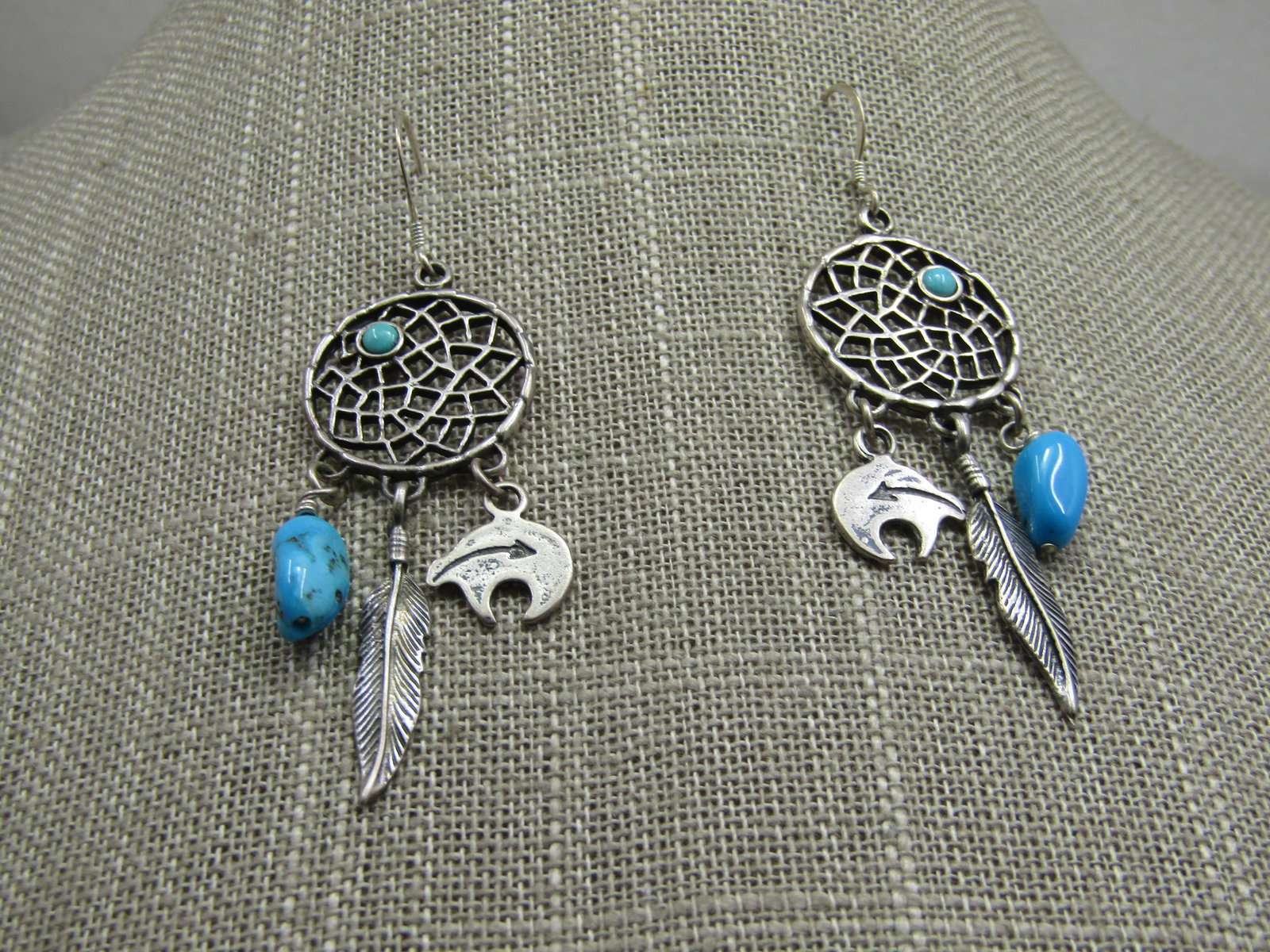 Vintage Sterling Southwestern Turquoise Dreamcatcher Earrings: Vintage Sterling Southwestern Turquoise Dreamcatcher Earrings, Pierced, 2.5" from bend in hook post. They have three dangles, a turquoise nugget appx 1/2" long with a center feather that is appx. 1"