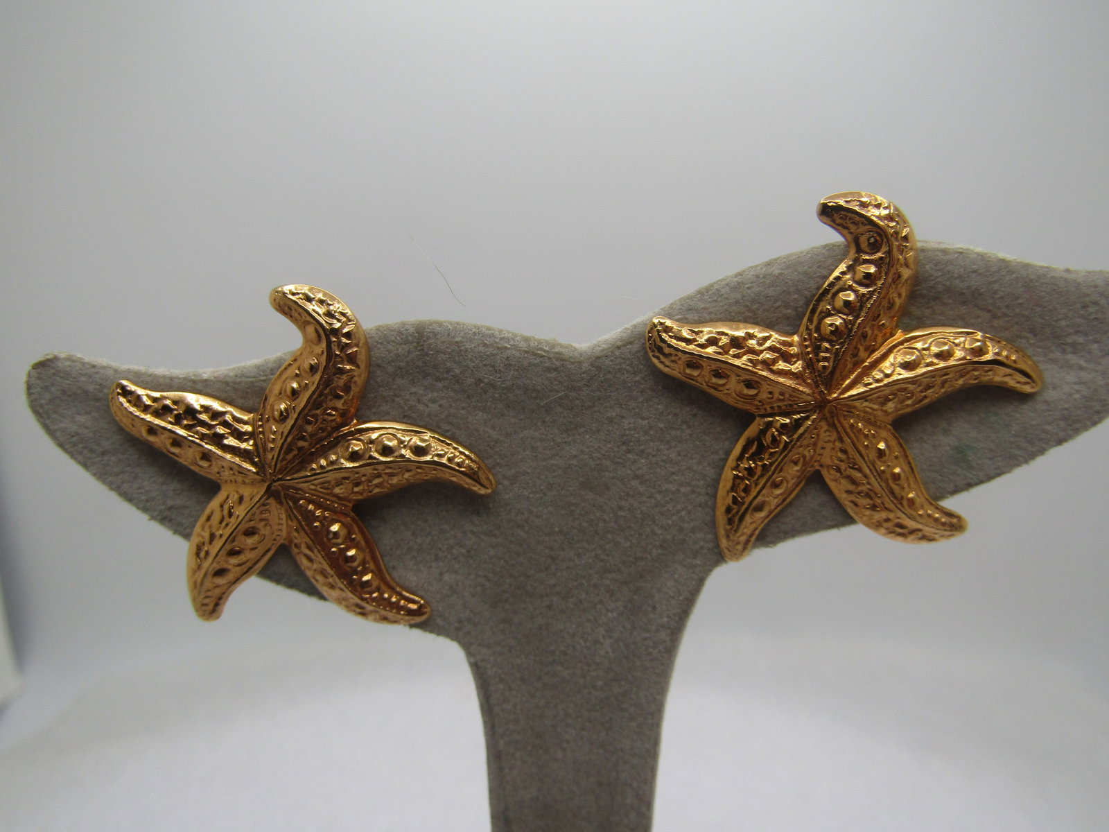 Vintage Pressed Starfish Earrings, Pierced, Gold Tone, 1.25", 1960's-1970's: Vintage Pressed Starfish Earrings, Pierced, Gold Tone, 1.25", 1960's-1970's. They are very clean and in very good condition with nice detail - lightweight for comfort. They are not signed by the maker