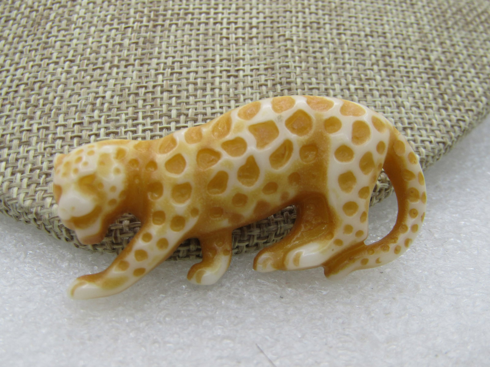 Vintage Leopard Brooch, Acrylic, 2" by 1", 1980's: Vintage Leopard Brooch, Acrylic, 2" by 1", 1980's. A pal tan acrylic with pressed sots that are washed with a darker tan. Not signed by the maker. Very good condition. (INV. W. 9.2020.5 SS3119 J LD