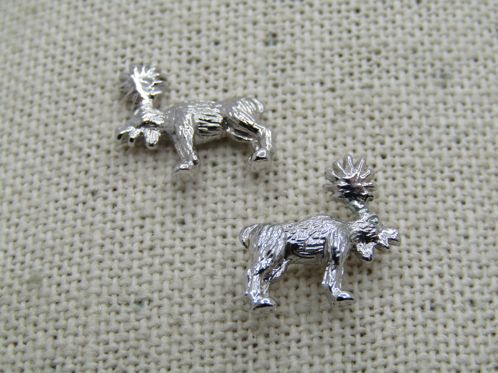 Silver Tone Moose Earrings, Pierced, 1980's-1990's: Silver Tone Moose Earrings, Pierced, 1980's-1990's. Bright and shiny silver tone textured moose earrings that are appx. 14mm wide and tall which is slightly over 1/2" in each direction. Very good -