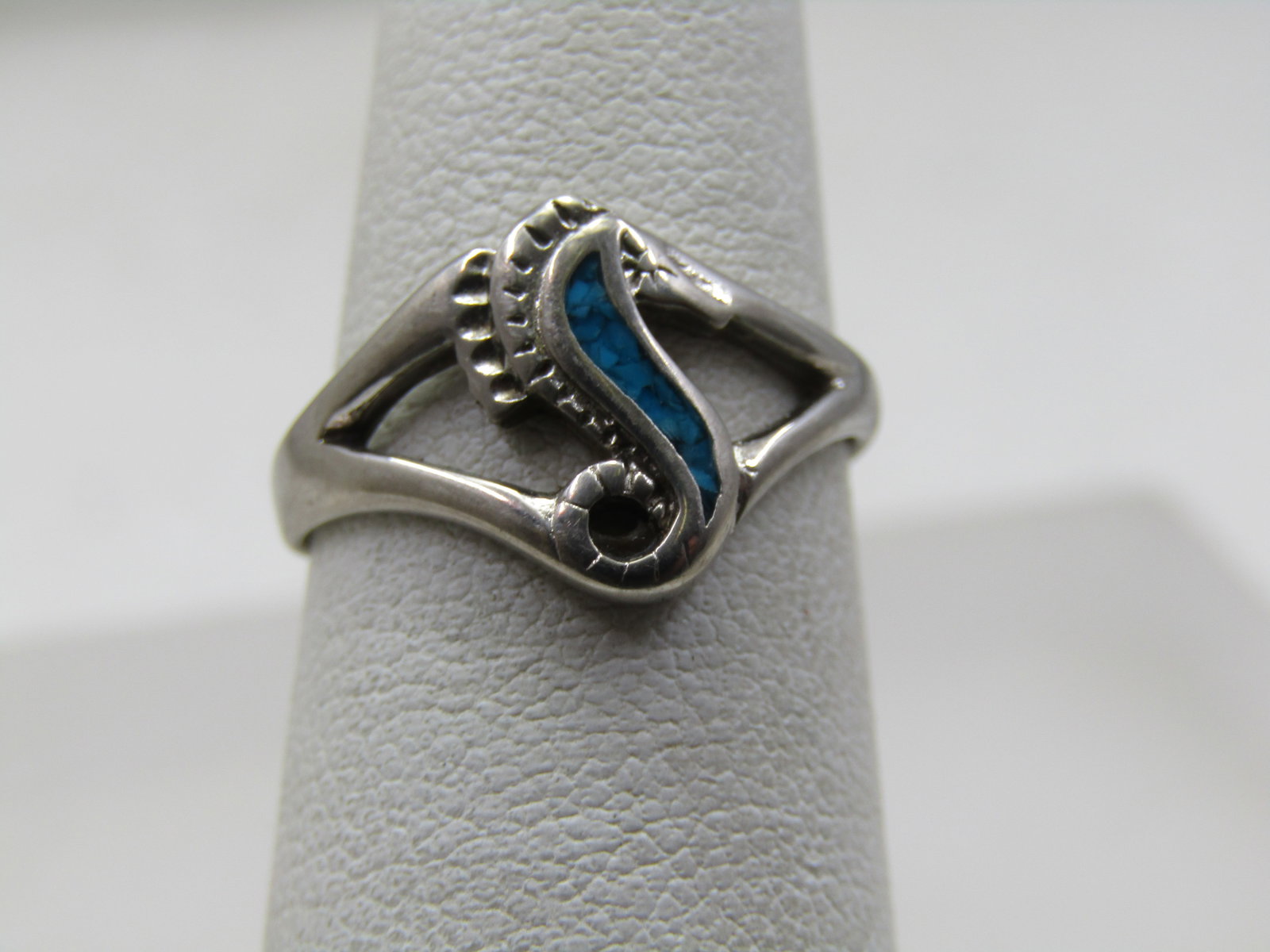 Vintage Turquoise Chip Inlaid Seahorse Ring, Sz. 5.5 , 1970's-1980's: Vintage Turquoise Chip Inlaid Seahorse Ring, Sz. 5.5 , 1970's-1980's. It is silver plated and signed with unknown maker's mark. The ring is appx. 1/2" down the finger with turquoise chips inlaid. 