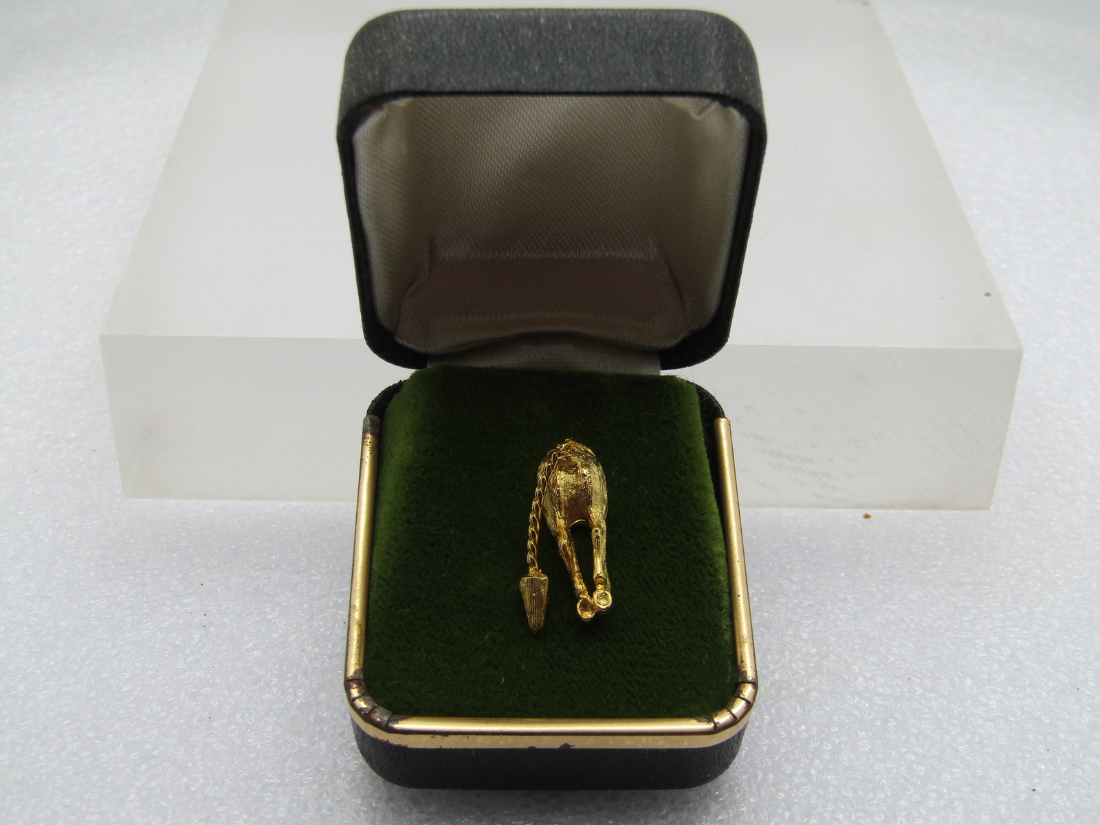 Vintage Donkey Butt Tack Pin in Original Box, 1960's-1970's: Vintage Donkey Butt Tack Pin in Original Box, 1960's-1970's. It is appx. 3/4" tall and 1/3" wide, textured and smooth finish with a dangling swinging tail. The clutch is signed Ballou, Very good,