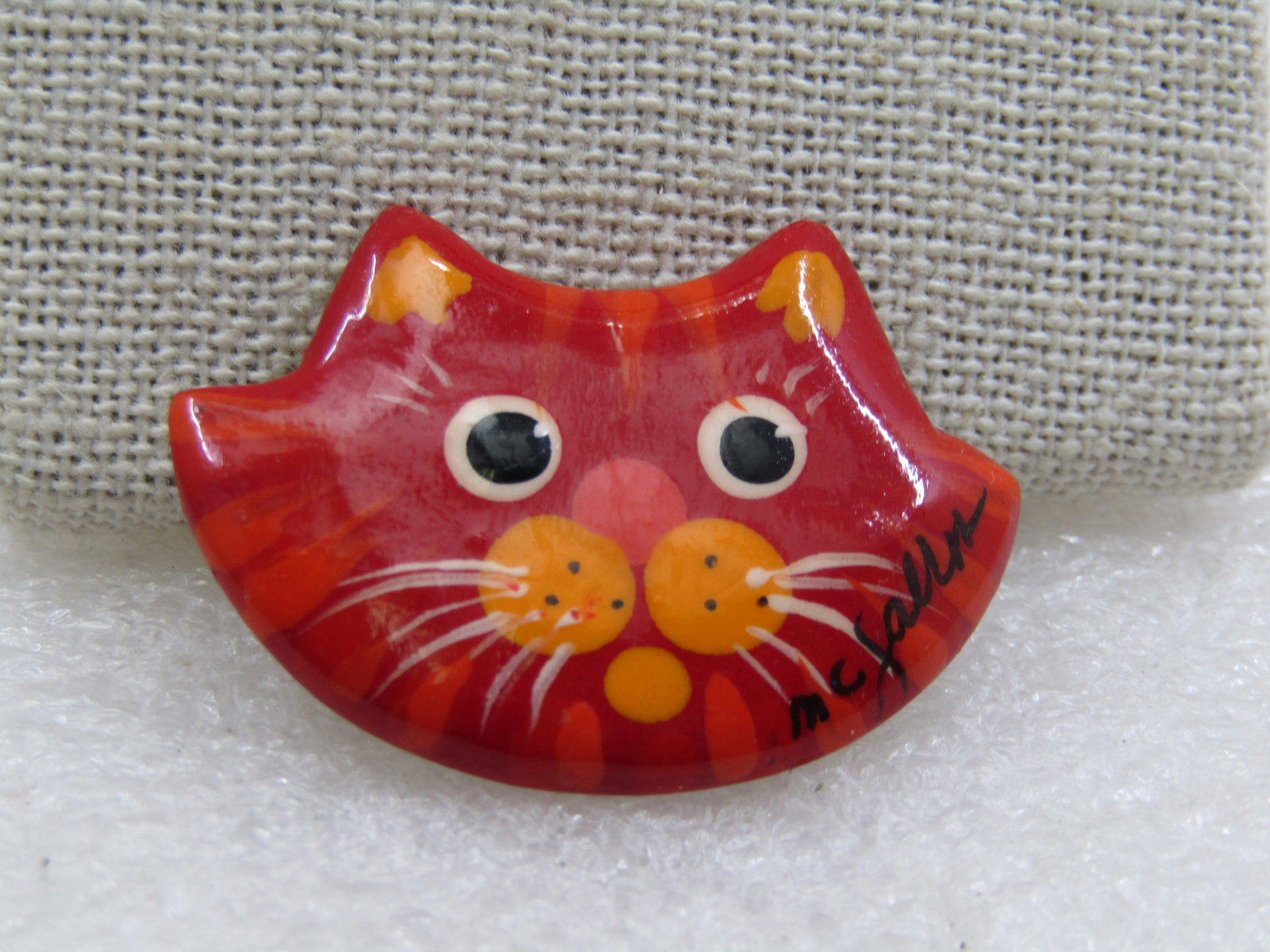 Vintage Hand Painted Cat Face Brooch, on Wood, Orange Tabby Signed: Vintage Hand Painted Cat Face Brooch, on Wood, Orange Tabby Signed by the artist M.C. Jallen or something like that. Cute little kitty face with orange tabby look, yellow and paler orange striping