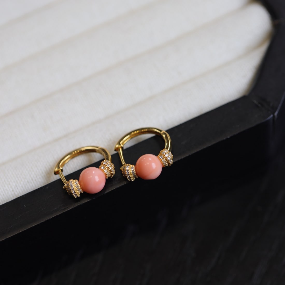 S925 silver earrings with red coral inlay: Title: S925 silver earrings with red coral inlay Description: These earrings feature natural red coral as the core, showcasing a delicate pink hue reminiscent of an angel's soft skin. The design is si