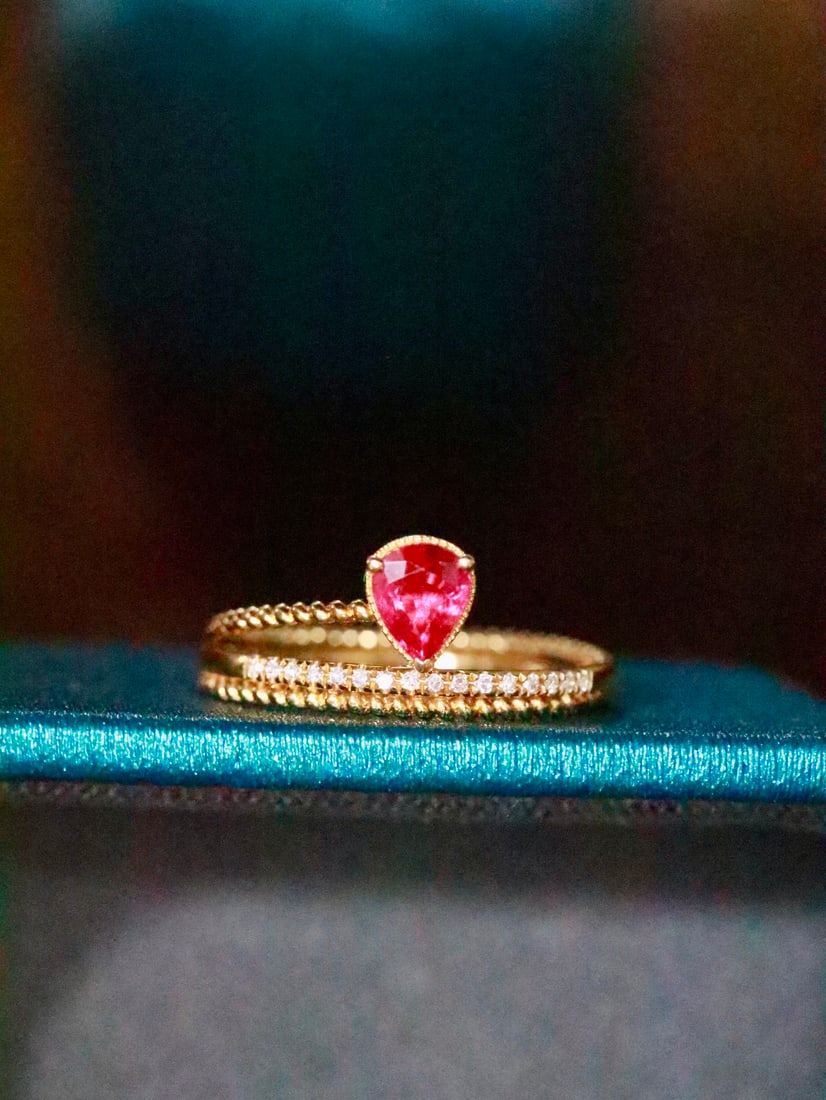 18K Gold Ruby Ring: Title: 18K Gold Ruby Ring Description: This 18K gold ruby ring, with its stunning design and the sophisticated pigeon blood red color, has become the center of attention. Whether admired from any