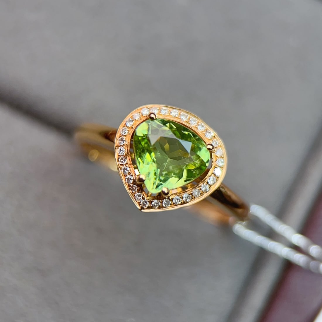 18K Gold Diamond and Tourmaline Ring: Title: 18K Gold Diamond and Tourmaline Ring Description: This ring features a high-quality tourmaline as its center stone, perfectly showcasing elegance and sophistication. The rich color of the