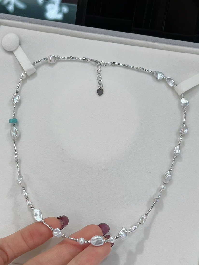 Silver green turquoise freshwater pearl necklace: Title: Silver green turquoise freshwater pearl necklace Description: This necklace cleverly combines design sensibility with elegance, perfectly showcasing the wearer's unique taste. The natural