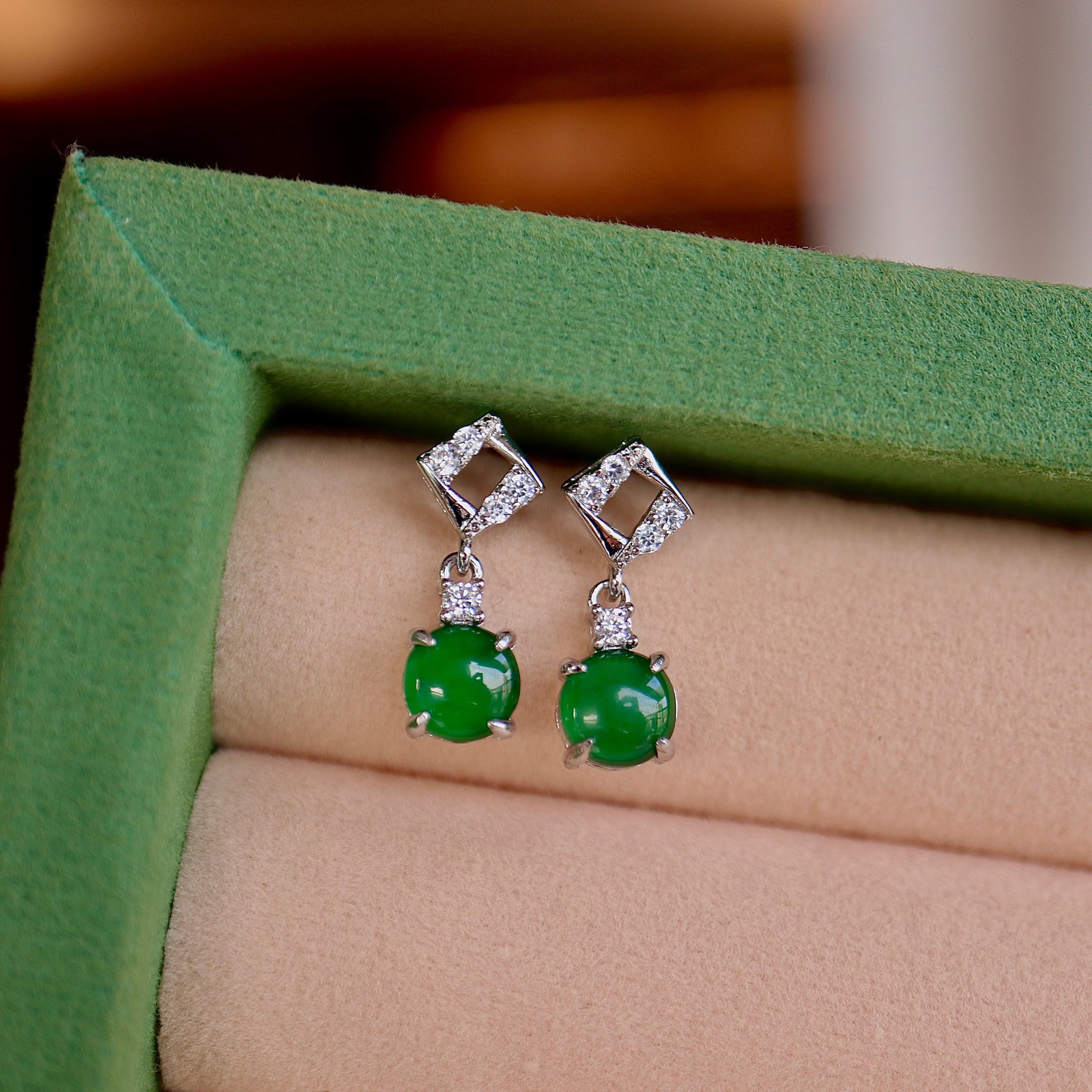 Jade earrings: Title: Jade earrings Description: These natural jade stud earrings, with their simple and elegant design, become the finishing touch of elegance for each wearer. The exquisite craftsmanship of the