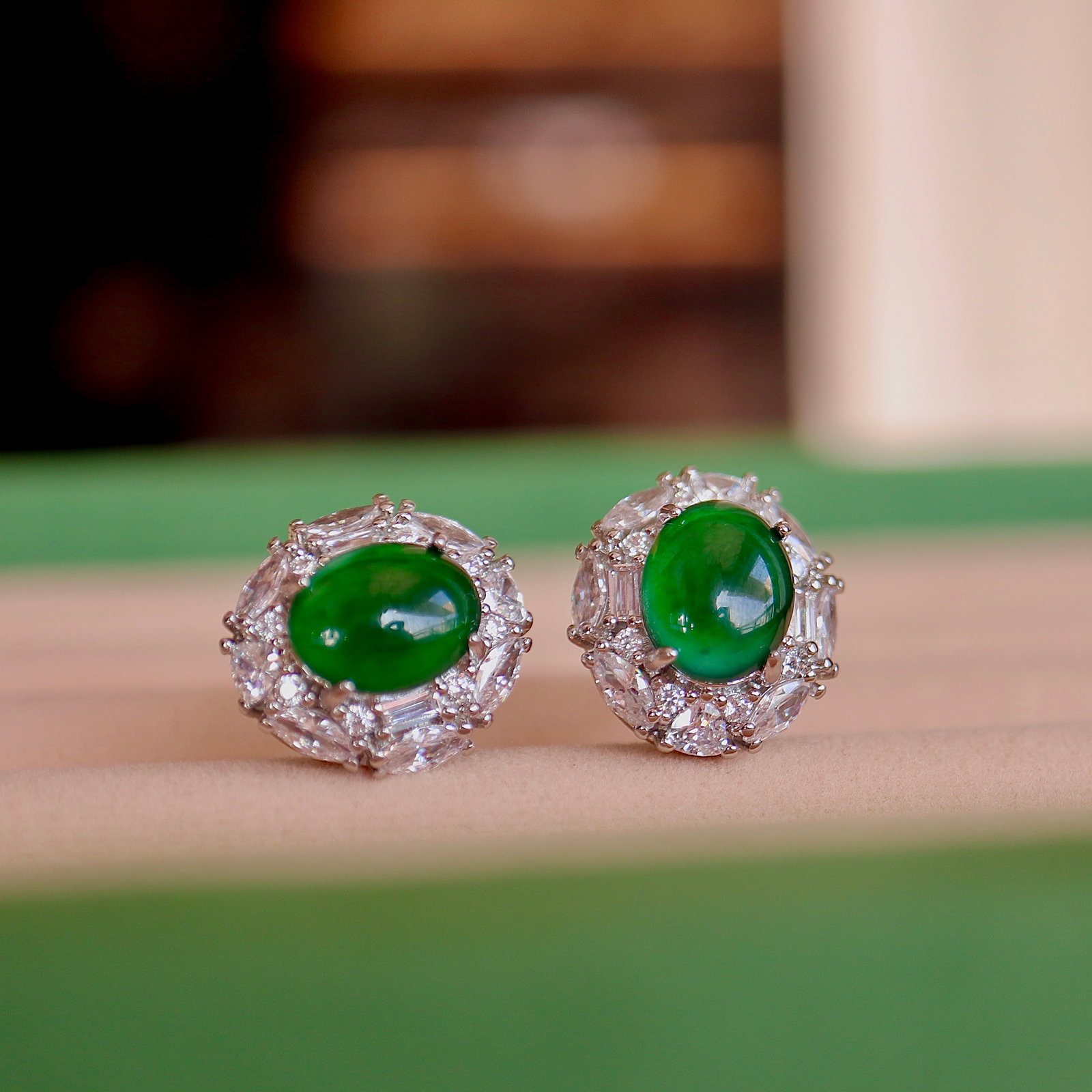 Jade earrings: Title: Jade earrings Description: This jade stud earring showcases unparalleled elegance with its simple design and exquisite inlay craftsmanship. It is full of green color, with rich and uniform