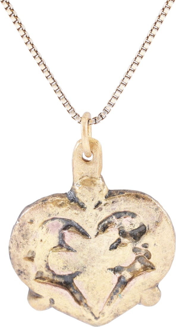 RARE ANCIENT VIKING HEART PENDANT NECKLACE, C.850-1050 AD: Classic heart form. Over 3/4" width (0.79"). Raised borders with an S scroll to the sides, and cusped top supporting a sprigged base trefoil, a favorite Viking theme. That feature evidently had spirit