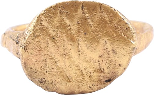 ROMAN/BYZANTINE CHRISTENING OR BAPTISM RING, C. 2ND-6TH CENTURY AD.: 2nd-6th Century AD. Gilt bronze, size about 1/2 which suggests a child of six months age or less. Slightly rounded face band, 1.3mm width flaring to the shoulders. Oval bezel with parallel zigzag line