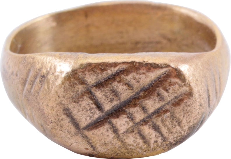 MEDIEVAL EUROPEAN MAN’S RING, SIZE 7: 11th-13th century. Size 7 with thick, 5.7mm band with the bottom nub in the Roman taste. Oval bezel cut with a lattice, probably serving as a signet ring to seal wax and clay replacing an inked signat