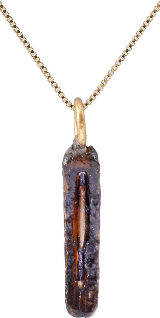 ROMAN GLASS BRACELET SEGMENT C.100-400 AD: A short segment of a Roman woman’s glass bracelet of the late Imperial period. About ¾” length of dark amber with yellow stripe hand wound glass. Suspended from an 18" Sterling silver