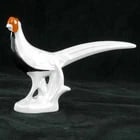 Silver Pheasant Porcelain Figurine: Title:Silver Pheasant Porcelain FigurineSize:7 ? in (18.4 cm) long x 2 in (5.1 cm) wide x 4 5/8 in (11.7 cm) tall.Description:A crisp, clean-lined depiction of a silver pheasant that is a study in