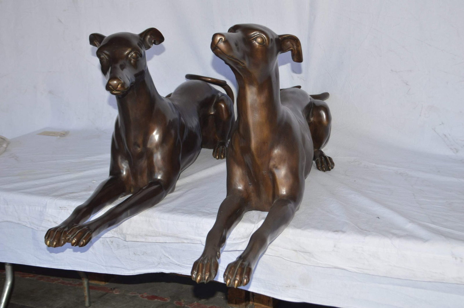 Pair of Greyhound dogs laying down Bronze Statues - Size: 50"L x 11"W x 20"H. - 9