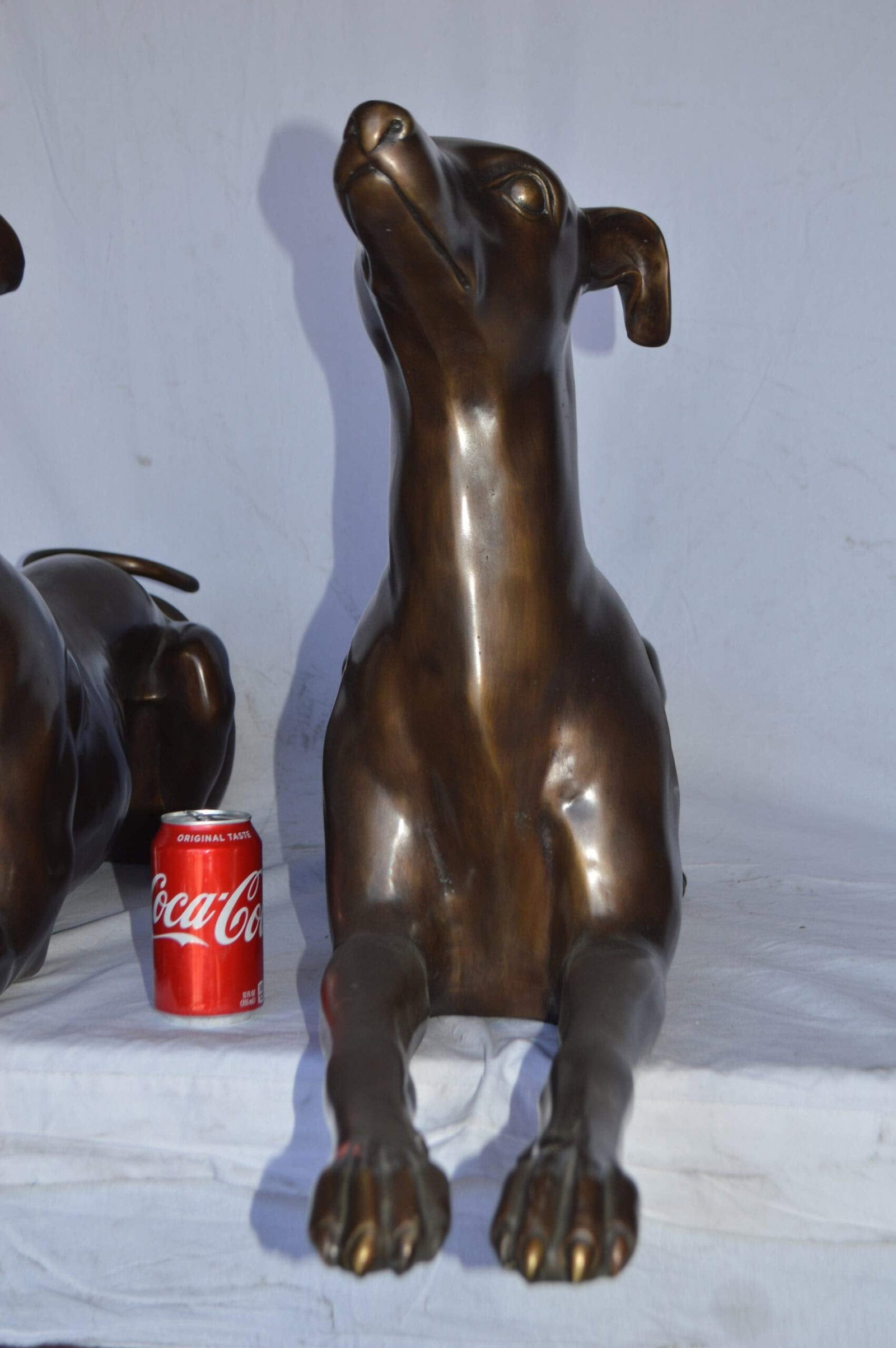 Pair of Greyhound dogs laying down Bronze Statues - Size: 50"L x 11"W x 20"H. - 7