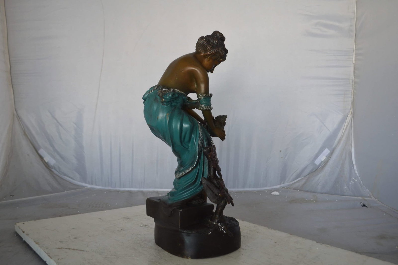 Lady holding a bird bronze statue - Size: 10"L x 9"W x 20"H. - 10