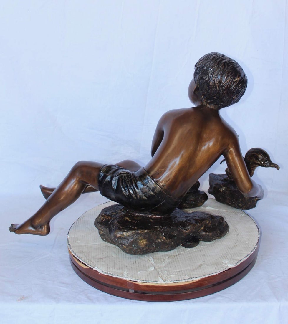 Adventurous boy with squirrel bronze statue - Size: 36"L x 18"W x 22"H. - 9