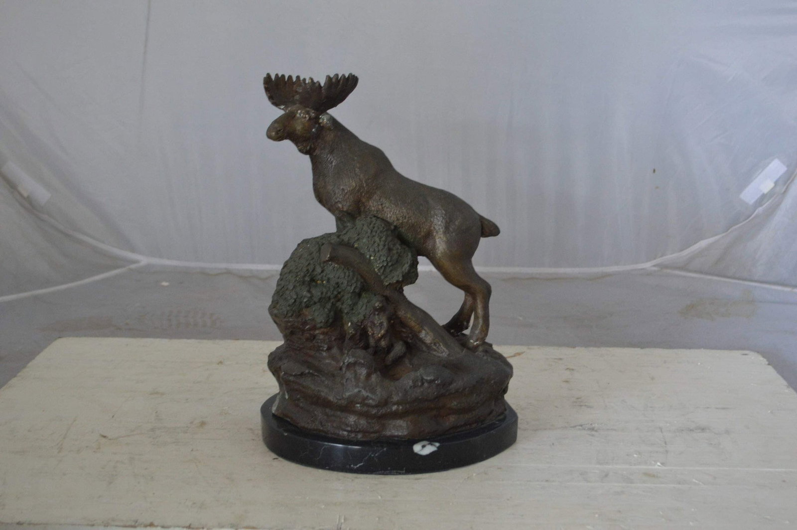 Moose on a rock bronze statue - Size: 9"L x 7"W x 14"H. - 4