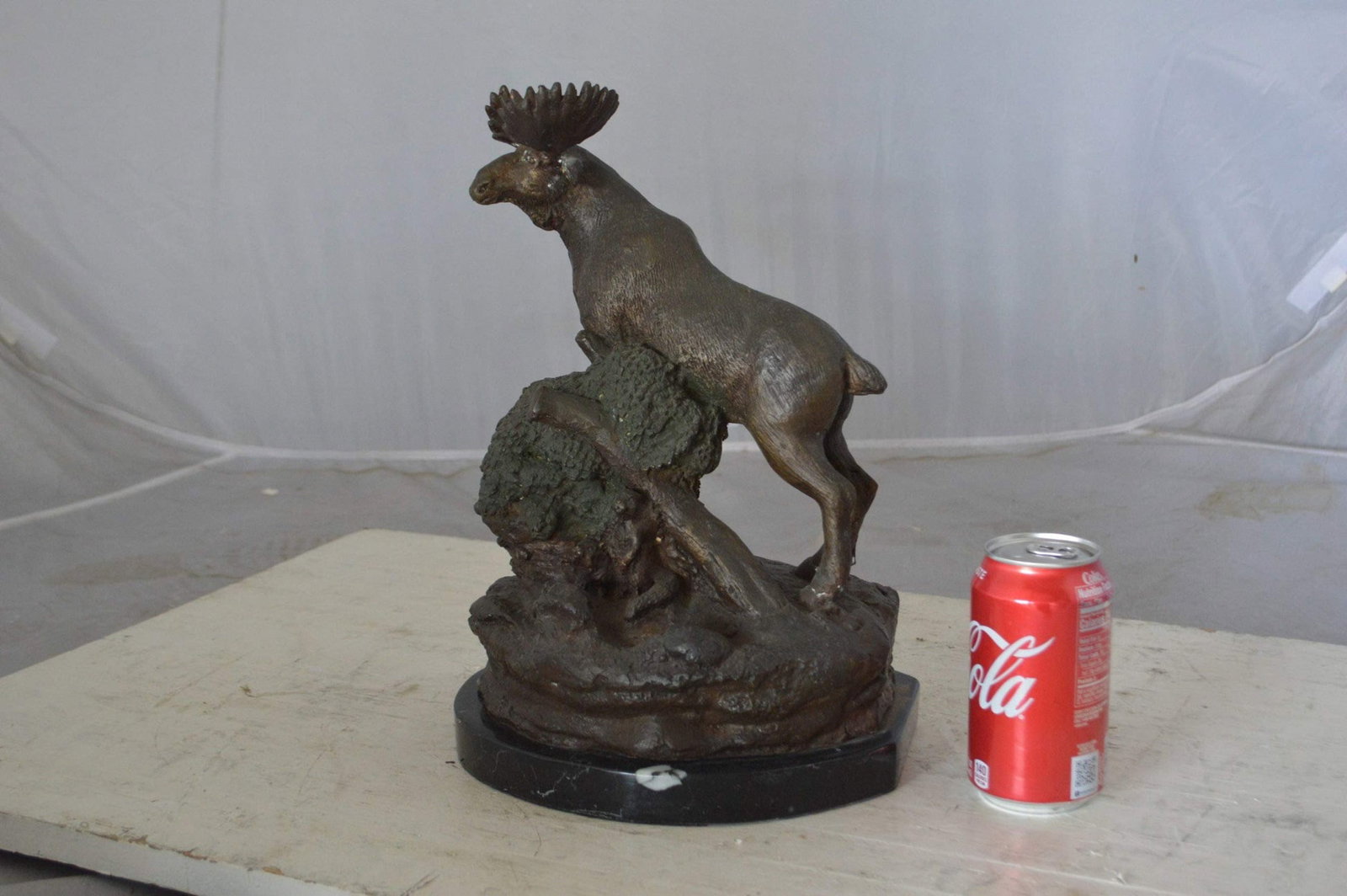 Moose on a rock bronze statue - Size: 9"L x 7"W x 14"H. - 5