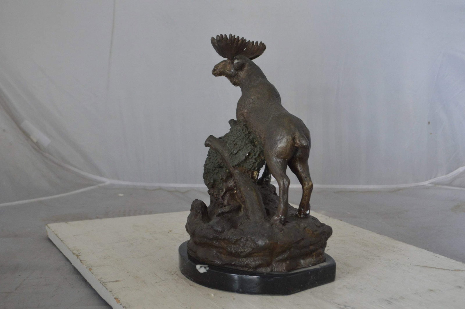 Moose on a rock bronze statue - Size: 9"L x 7"W x 14"H. - 6