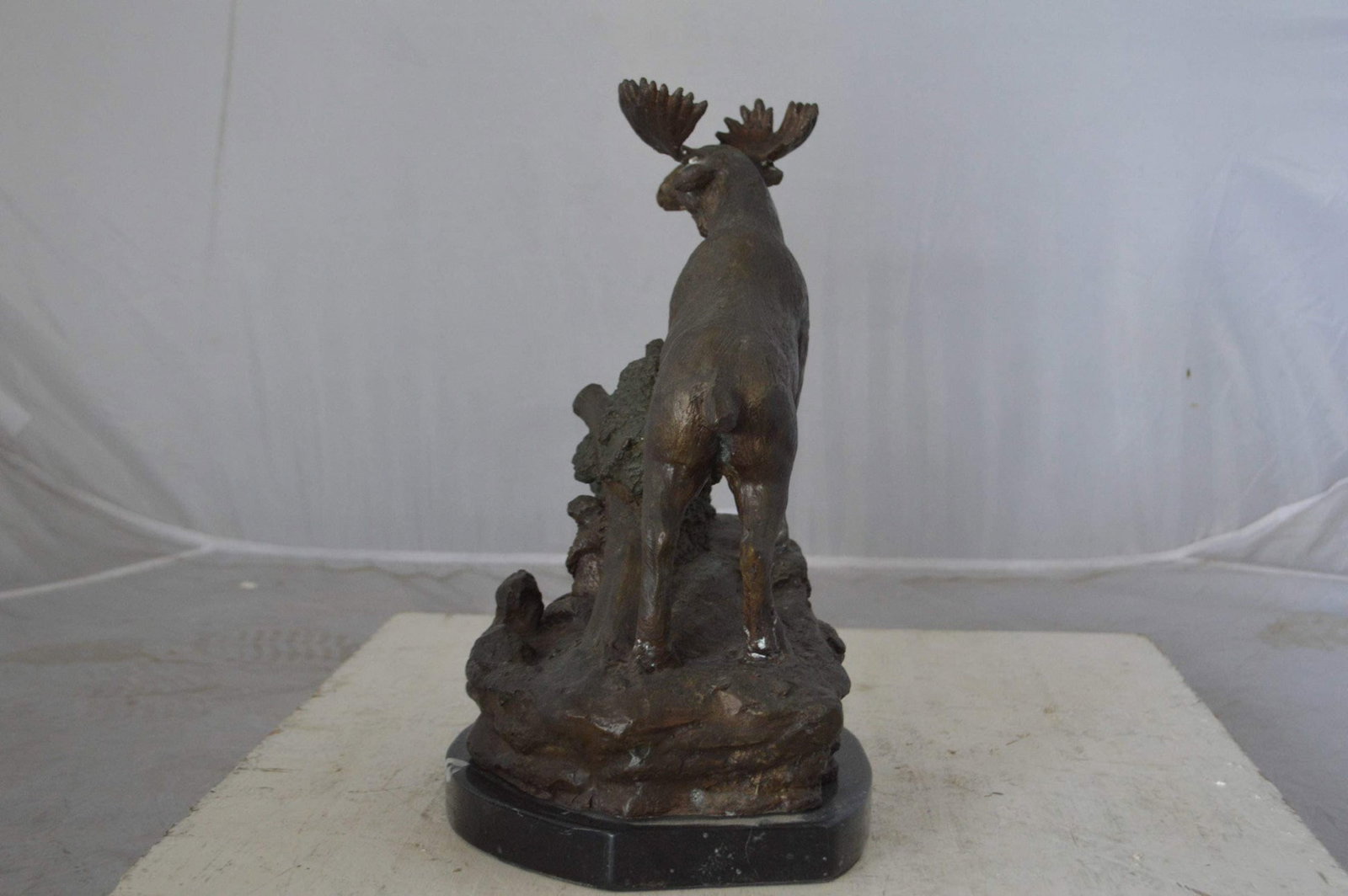 Moose on a rock bronze statue - Size: 9"L x 7"W x 14"H. - 7