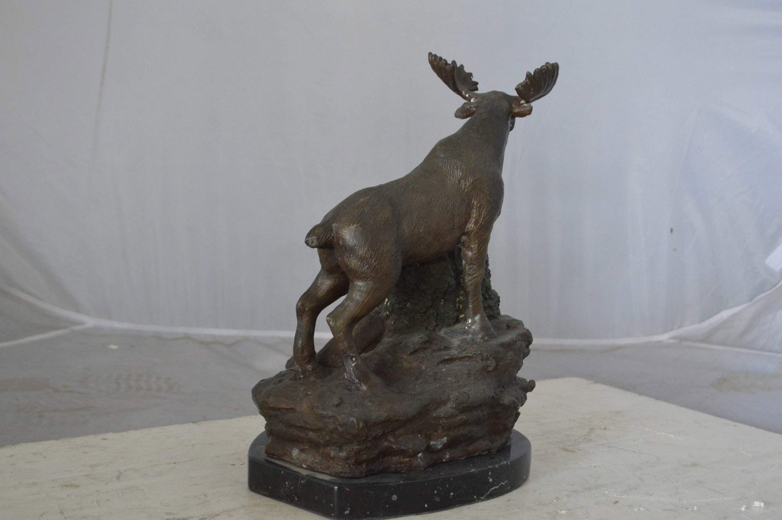 Moose on a rock bronze statue - Size: 9"L x 7"W x 14"H. - 8