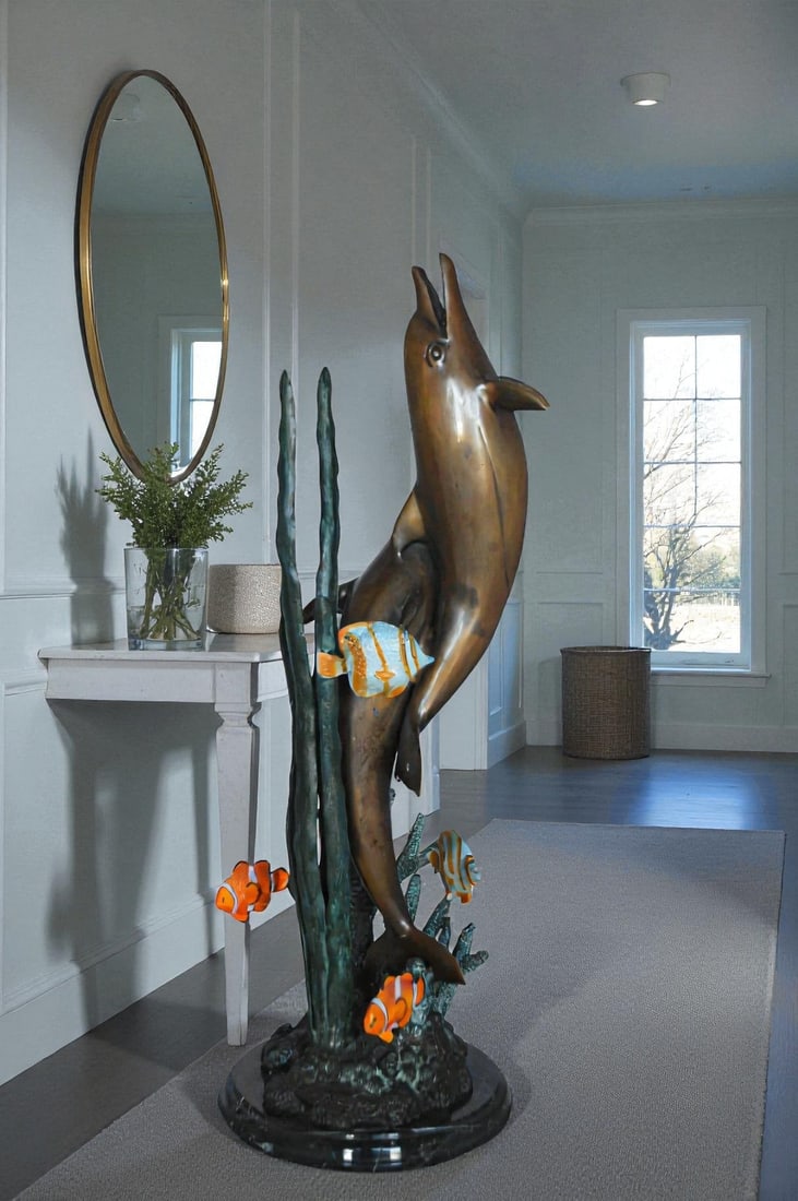 Two dolphins with fish, table top bronze statue. - Size: 8"L x 8"W x 22"H. - 2