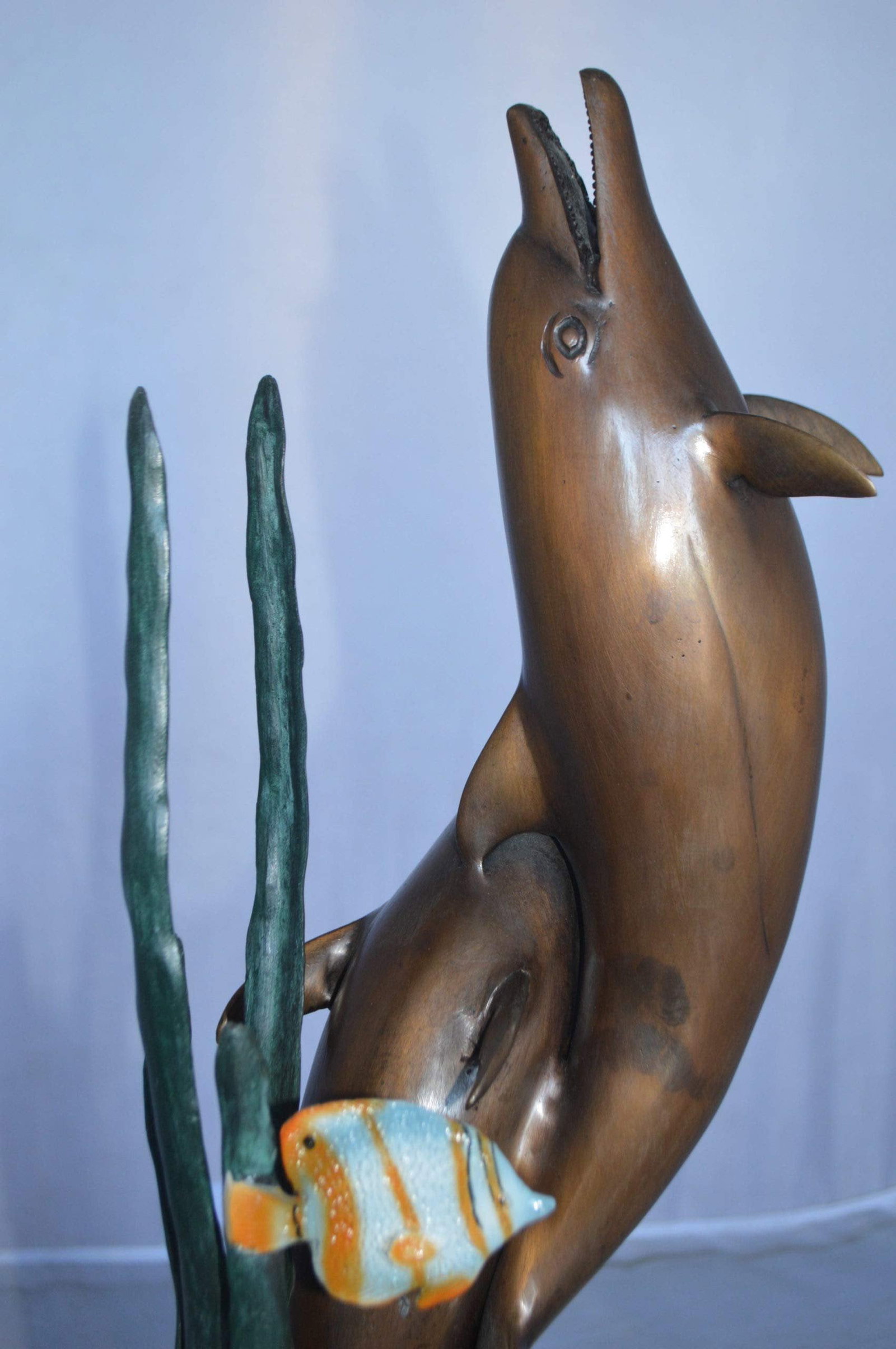 Two dolphins with fish, table top bronze statue. - Size: 8"L x 8"W x 22"H. - 5