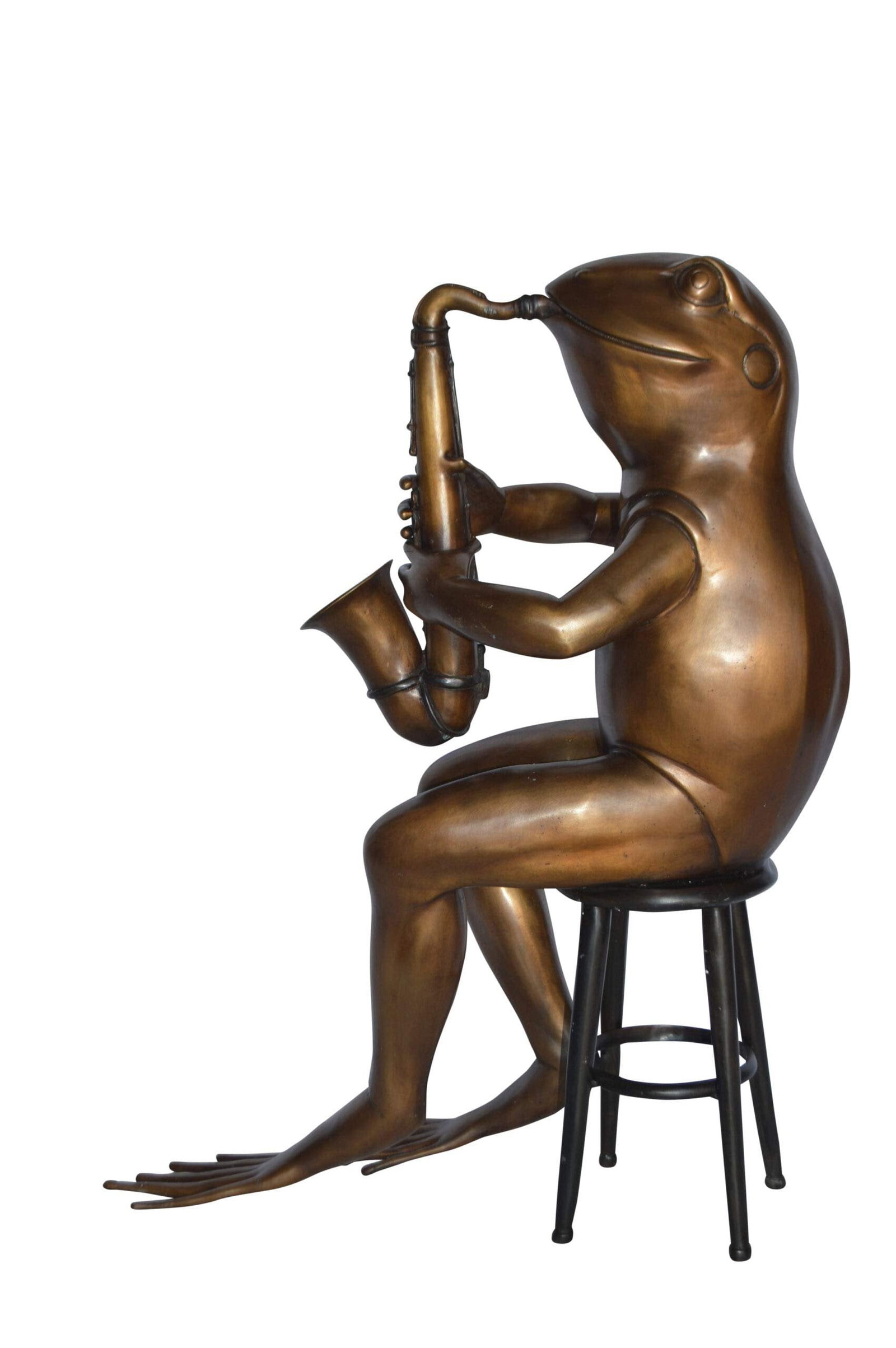 Frog playing saxophone bronze statue - Size: 23"L x 15"W x 30"H.: Title:Frog playing saxophone bronze statue - Size: 23"L x 15"W x 30"H. Description:This bronze statue of a frog sitting in his chair playing a trumpet is artistic in style and humor. The light-hearted