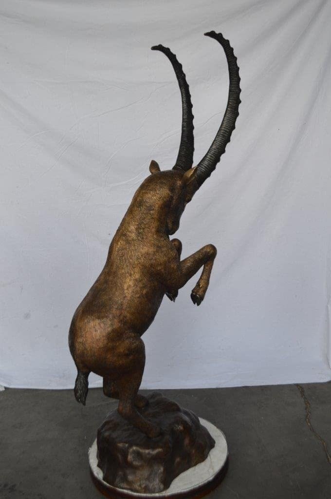 Mountain goat on hind legs bronze statue - Size: 36"L x 16"W x 66"H. - 10