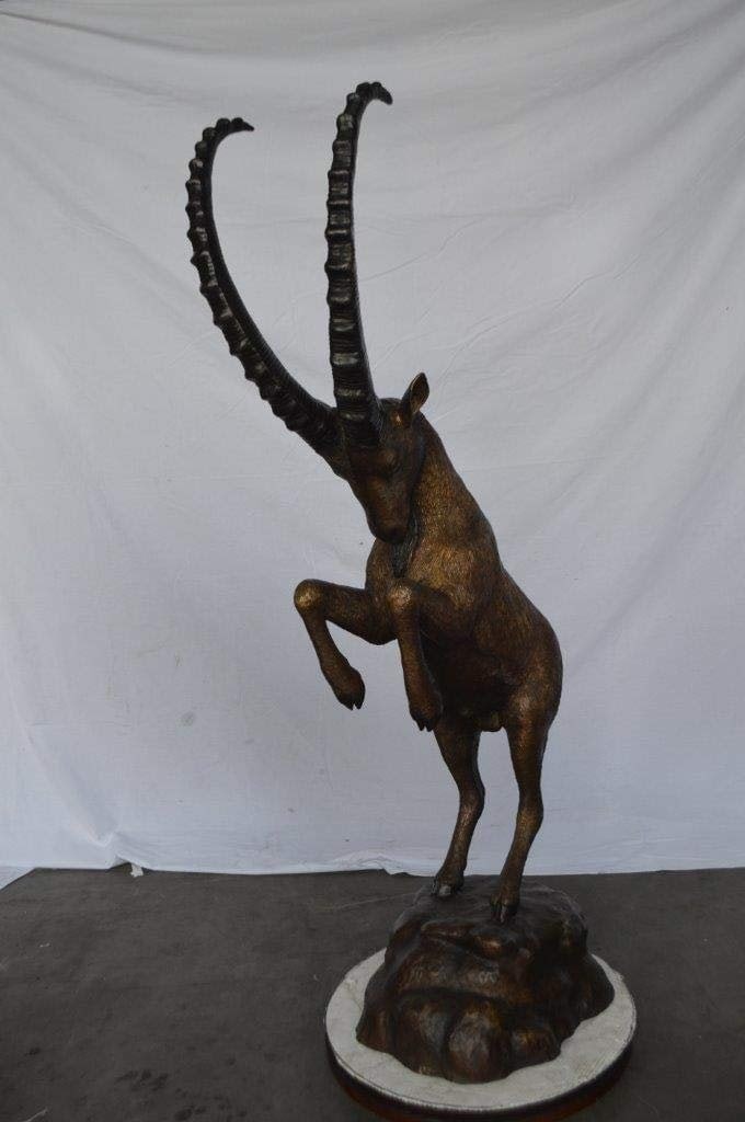 Mountain goat on hind legs bronze statue - Size: 36"L x 16"W x 66"H. - 5