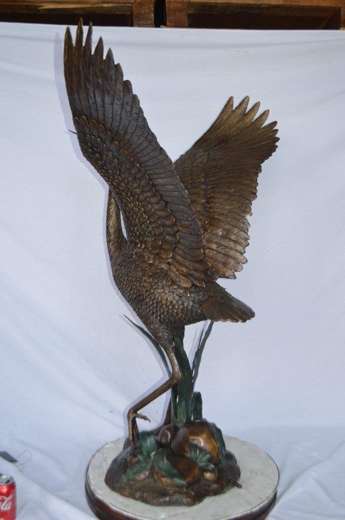Crane standing on a stone bronze statue - Size: 28"L x 32"W x 49"H. - 9