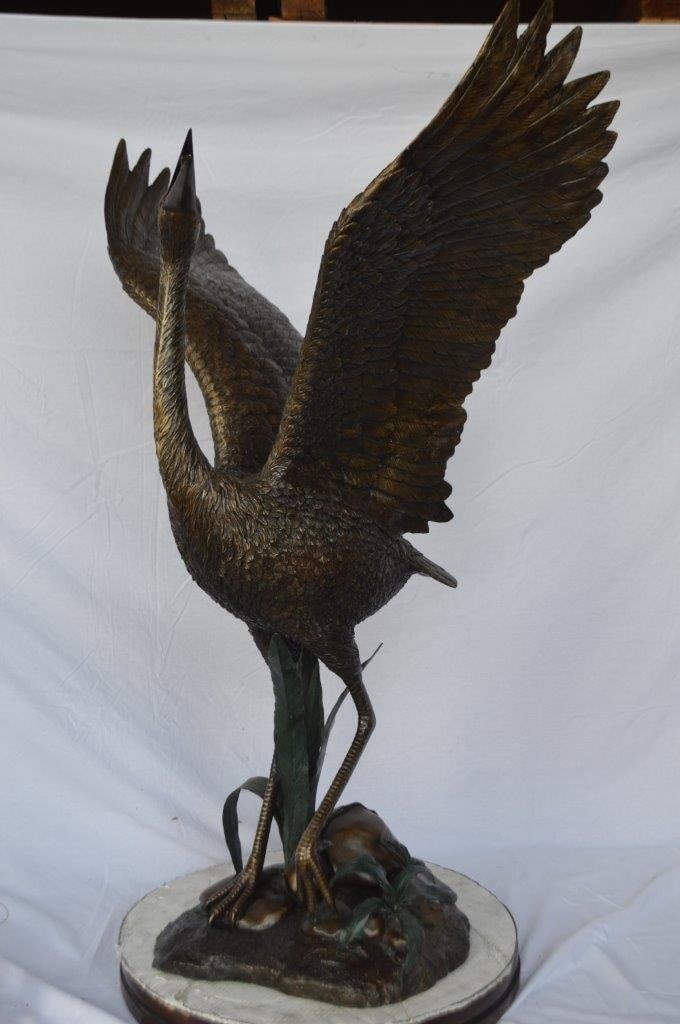 Crane standing on a stone bronze statue - Size: 28"L x 32"W x 49"H. - 11