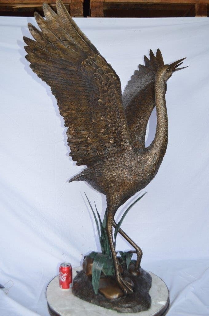 Crane standing on a stone bronze statue - Size: 28"L x 32"W x 49"H. - 4
