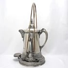 Victorian Silverplate Tilting Water Pitcher Rogers & Brittin: Title:Victorian Silverplate Tilting Water Pitcher Rogers & BrittinSize:The frame - 19 5/8 in (49.8 cm) tall x 9 in (22.9 cm) diameter. Pitcher ? 13 in (33.0 cm) tall x 7 ? in (19.0 cm)