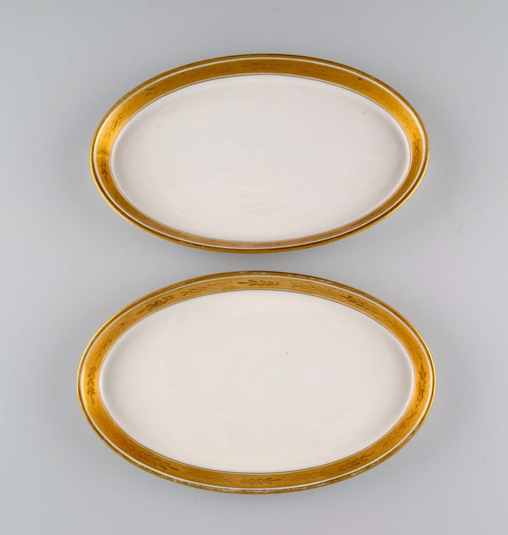 Royal Copenhagen service no. 607. Two oval porcelain dishes. Gold border with foliage. Model number (1 of 5)