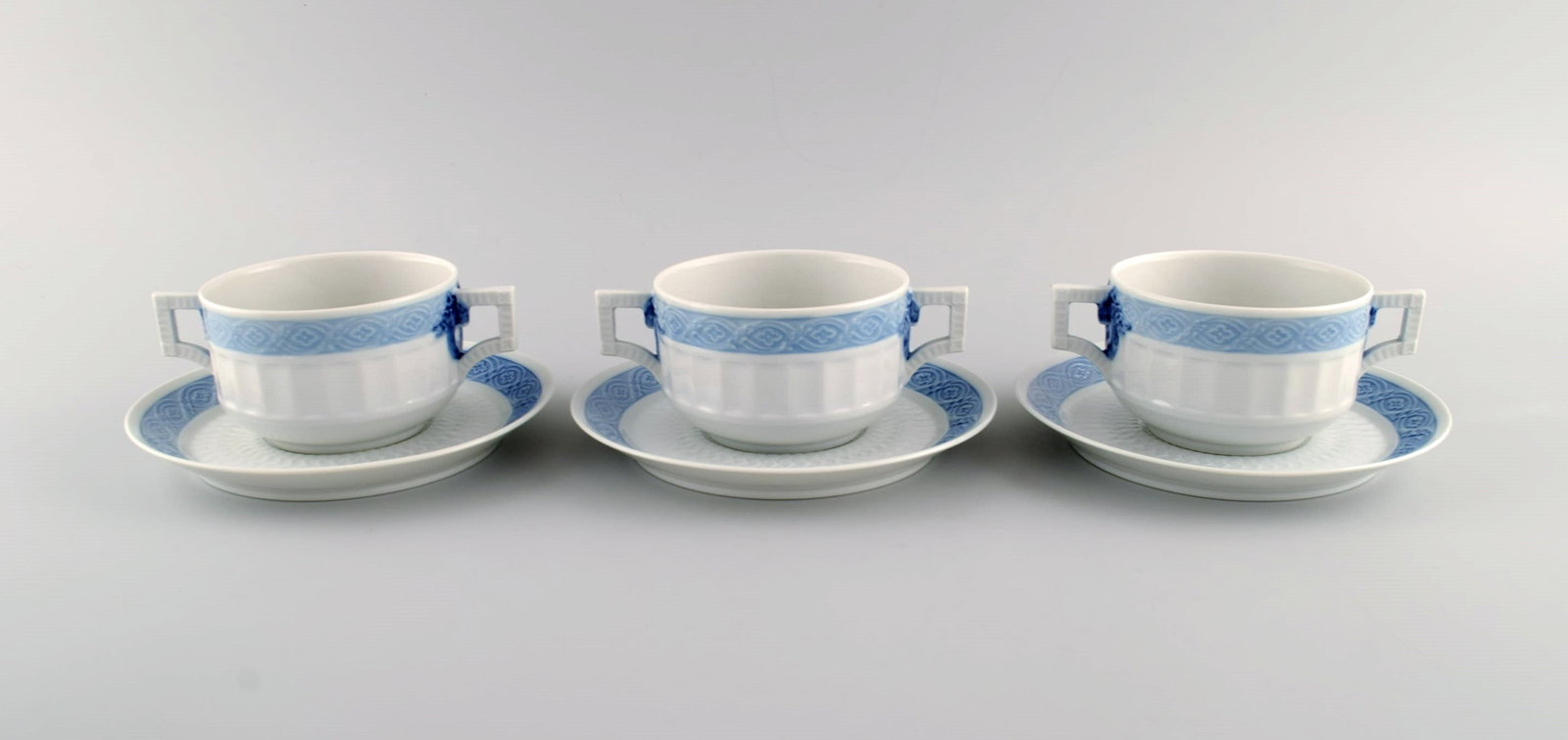 Three Royal Copenhagen Blue Fan bouillon cups with saucers. Designed by Arnold Krog in 1909. (1 of 5)