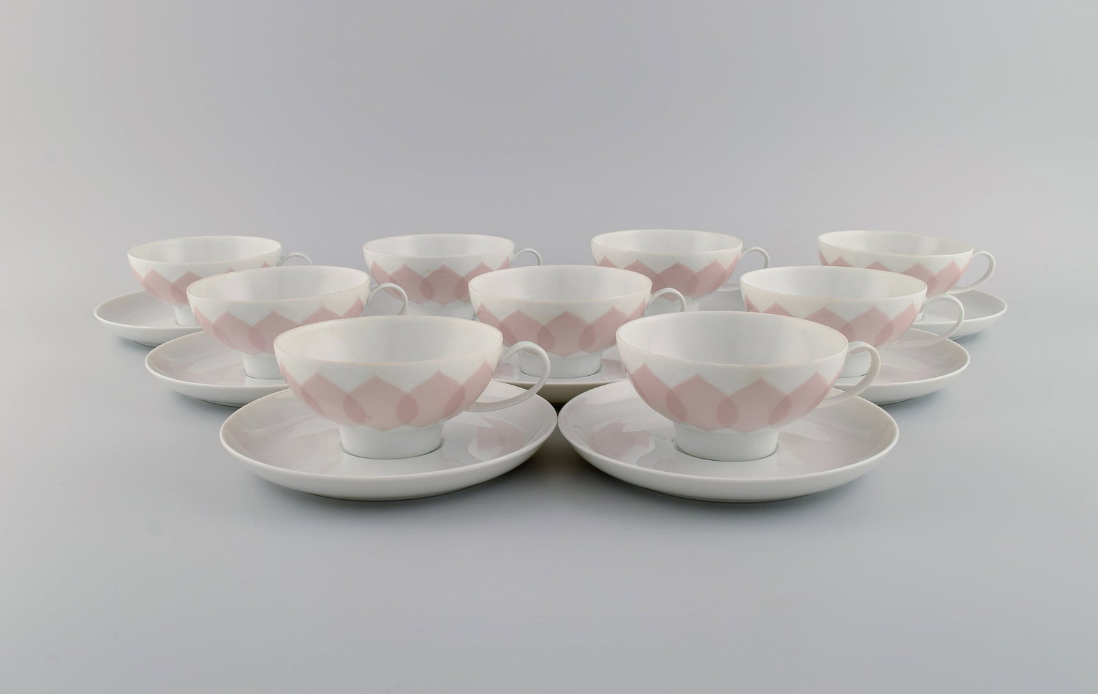 Bjørn Wiinblad for Rosenthal. Lotus porcelain service. 9 teacups with saucers decorated with (1 of 5)
